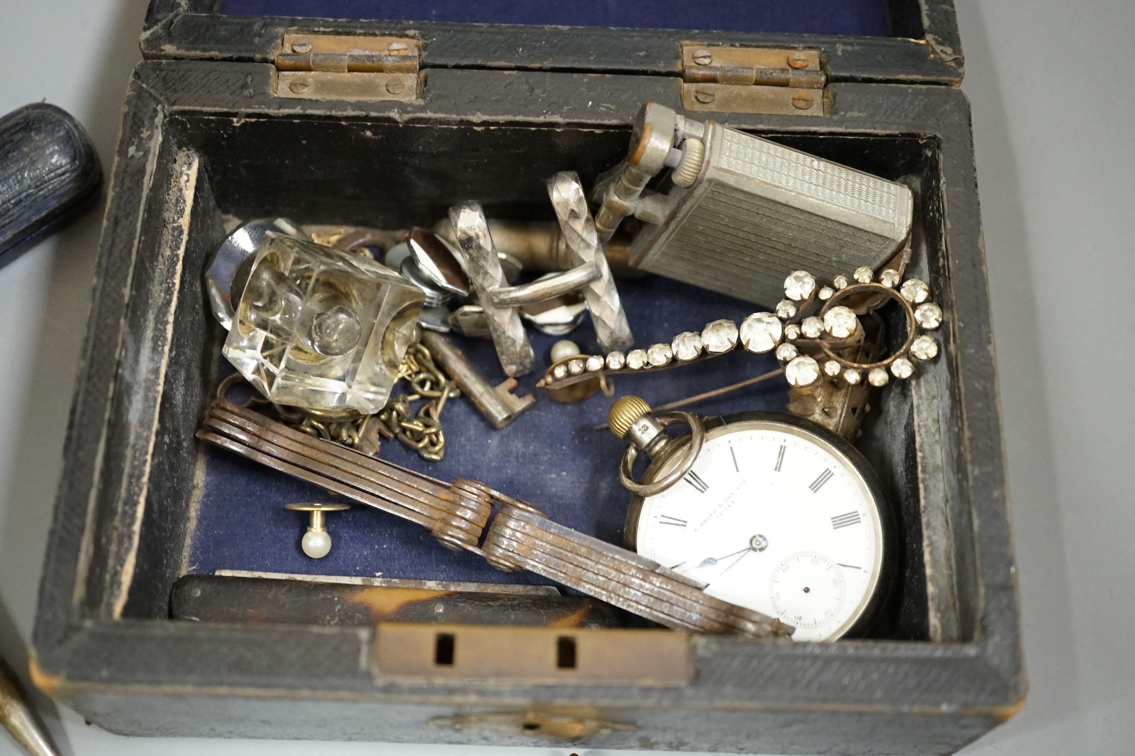 An amber and gilt metal mounted cigarette holder, gilt metal lighter etc